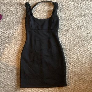 Brand: Guess Los Angeles size two black sleeveless, halter neck, cocktail dress.